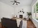 Inviting living room featuring a fireplace and hardwood floors at 10032 Montrose Nw Dr, Charlotte, NC 28269