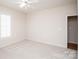 Carpeted bedroom featuring fresh paint, ceiling fan, and natural light at 10034 Bishops Gate Blvd, Pineville, NC 28134