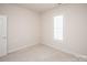 Bedroom featuring neutral carpet, fresh paint and window with shutters at 10034 Bishops Gate Blvd, Pineville, NC 28134