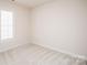 Bedroom featuring plush carpet, window with shutters, and fresh paint at 10034 Bishops Gate Blvd, Pineville, NC 28134