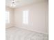 Bedroom featuring plush carpet and natural light from shuttered windows at 10034 Bishops Gate Blvd, Pineville, NC 28134