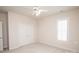 Bedroom featuring plush carpet, ceiling fan, shuttered window and closet at 10034 Bishops Gate Blvd, Pineville, NC 28134