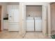 Convenient laundry area with a washer and dryer located adjacent to the kitchen at 10034 Bishops Gate Blvd, Pineville, NC 28134