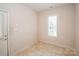 Small mud room with tile floors and a door to the exterior at 10034 Bishops Gate Blvd, Pineville, NC 28134