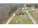 Aerial view of the home with a long driveway and well-maintained lawn and landscape at 1011 Duntov Dr, Monroe, NC 28110