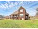 Large brick home with a spacious, well-maintained backyard at 1011 Duntov Dr, Monroe, NC 28110