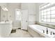 Bathroom with tub and a large window at 1011 Duntov Dr, Monroe, NC 28110
