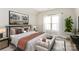 Serene bedroom featuring a comfortable bed, soft lighting, and a decorative tree at 1011 Duntov Dr, Monroe, NC 28110