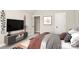 Modern bedroom with TV, console table and door leading to the rest of the house at 1011 Duntov Dr, Monroe, NC 28110