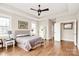Spacious bedroom with tray ceilings, ceiling fan and two large windows at 1011 Duntov Dr, Monroe, NC 28110