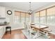 Bright dining area features a wooden table, bench, and large windows with views at 1011 Duntov Dr, Monroe, NC 28110
