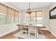 Dining area with natural light, wood table, neutral colors, and backyard view at 1011 Duntov Dr, Monroe, NC 28110