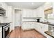 Bright kitchen features white cabinetry, tile backsplash, and stainless steel appliances at 1011 Duntov Dr, Monroe, NC 28110