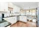 Well-lit kitchen features granite countertops, white cabinets, and stainless steel appliances at 1011 Duntov Dr, Monroe, NC 28110