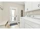 Bright laundry room with a door to the back at 1011 Duntov Dr, Monroe, NC 28110