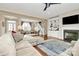 Cozy living room features fireplace, built-in shelves, and open access to a staircase at 1011 Duntov Dr, Monroe, NC 28110