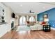 Modern living room with a blue accent wall, fireplace, and comfortable seating at 1011 Duntov Dr, Monroe, NC 28110