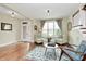Inviting living room with hardwood floors, bright window, and seating area, creating a cozy and stylish space at 1011 Duntov Dr, Monroe, NC 28110