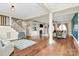 Open living room with hardwood floors, fireplace, and ample natural light at 1011 Duntov Dr, Monroe, NC 28110