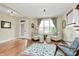 Bright living room with comfortable seating, hardwood floors, and a modern design at 1011 Duntov Dr, Monroe, NC 28110