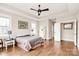 Spacious main bedroom with hardwood floors, large windows, and neutral paint at 1011 Duntov Dr, Monroe, NC 28110