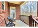 Relaxing covered porch with dark metal furniture and a view of the outdoor scenery at 1011 Duntov Dr, Monroe, NC 28110