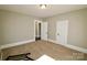 Carpeted bedroom with neutral walls and two closets creating a clean, blank canvas at 104 N 9Th St, Bessemer City, NC 28016