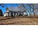 View of the side of the house in a wooded lot at 1116 Medlin Rd, Monroe, NC 28112