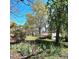 Secluded outbuilding nestled among trees and lush greenery, providing a private setting at 1116 Medlin Rd, Monroe, NC 28112