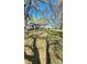 Expansive front lawn with mature trees surrounding a traditional white home at 1116 Medlin Rd, Monroe, NC 28112
