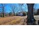 Beautiful front yard featuring mature trees and landscaping at 1116 Medlin Rd, Monroe, NC 28112