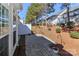 Wide view of a backyard patio surrounded by white fencing and evergreen trees at 128 S Arcadian Way, Mooresville, NC 28117