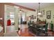 Open layout of dining area showing access to living room with ample natural light at 128 S Arcadian Way, Mooresville, NC 28117