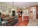 Cozy dining area next to the kitchen features stylish decor and wooden floors at 128 S Arcadian Way, Mooresville, NC 28117