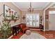 Charming dining room with hardwood floors, chandelier, and bright windows at 128 S Arcadian Way, Mooresville, NC 28117