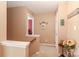 Neutral-toned hallway featuring decor accents and access to other rooms on the upper level at 128 S Arcadian Way, Mooresville, NC 28117
