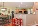 Eat-in kitchen features light wood cabinets, stainless appliances, breakfast bar, and dining area at 128 S Arcadian Way, Mooresville, NC 28117
