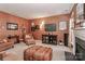 Comfortable living room featuring neutral colors, a fireplace and mounted television at 128 S Arcadian Way, Mooresville, NC 28117