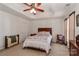 Bright bedroom with a tray ceiling, complemented by a ceiling fan and neutral walls at 128 S Arcadian Way, Mooresville, NC 28117