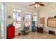 Bright sunroom featuring a ceiling fan, tile flooring, and lots of natural light at 128 S Arcadian Way, Mooresville, NC 28117
