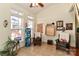 Bright sunroom featuring a ceiling fan, tile flooring, and lots of natural light at 128 S Arcadian Way, Mooresville, NC 28117