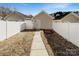 Fenced backyard with a shed, offering privacy and extra storage space at 13811 Waverton Ln, Huntersville, NC 28078