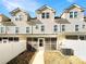 Townhome backyard with a screened patio and a fenced yard at 13811 Waverton Ln, Huntersville, NC 28078