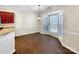 Bright dining room featuring hardwood floors, chair rail molding, and bay windows at 13811 Waverton Ln, Huntersville, NC 28078