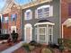 Attractive townhome with a combination of vinyl siding and stone accents on the facade at 13811 Waverton Ln, Huntersville, NC 28078