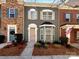 Charming townhome with a landscaped front yard and a mix of brick and siding facade at 13811 Waverton Ln, Huntersville, NC 28078