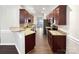 Updated kitchen featuring granite countertops, cherry cabinets, and stainless appliances at 13811 Waverton Ln, Huntersville, NC 28078