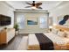 Serene main bedroom with a tray ceiling, recessed lights, and neutral décor at 13811 Waverton Ln, Huntersville, NC 28078