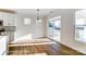 Bright dining area with wood floors, modern lighting, and sliding glass doors to the outside at 146 Prestwick Way # 20, Mooresville, NC 28115