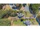 An aerial view of the property and surrounding homes in a wooded neighborhood with mature trees at 165 Blue Ridge Trl, Mooresville, NC 28117
